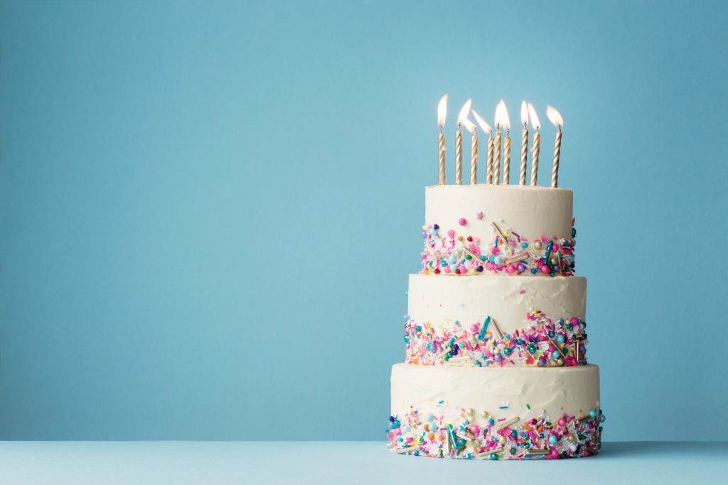 Tiered birthday cake with sprinkles